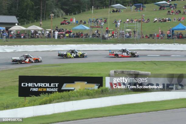 Noah Gragson, driver of the Safelite AutoGlass Toyota, leads Justin Haley, driver of the Fraternal Order of Eagles Chevrolet, as he drives around...