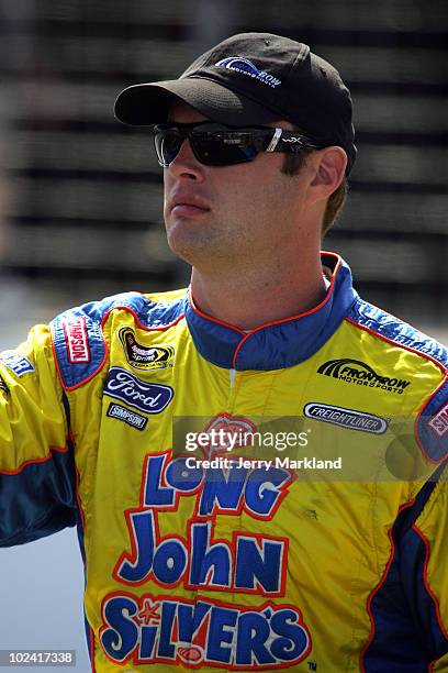 Travis Kvapil, driver of the Long John Silver's Ford, stands on the grid during qualifying for the NASCAR Sprint Cup Series LENOX Industrial Tools...