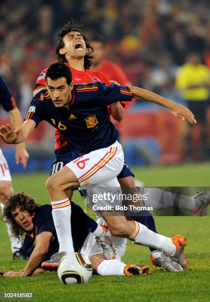 Sergio Busquets of Spain takes the ball from Jorge Valdivia of Chile during the 2010 FIFA World Cup South Africa Group H match between Chile and...