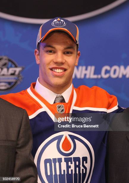 Taylor Hall, drafted overall by the Edmonton Oilers, poses on stage during the 2010 NHL Entry Draft at Staples Center on June 25, 2010 in Los...