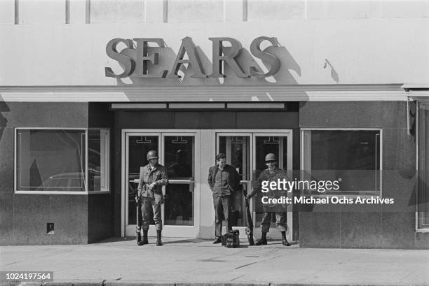 Soldiers guarding a Sears department store during a period of rioting in Baltimore, Maryland, following the assassination of civil rights activist...