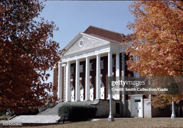 Side view with autumn trees of the Hughes Memorial Auditorium at Asbury University, a Christian liberal arts university in Wilmore, Kentucky, 1955.