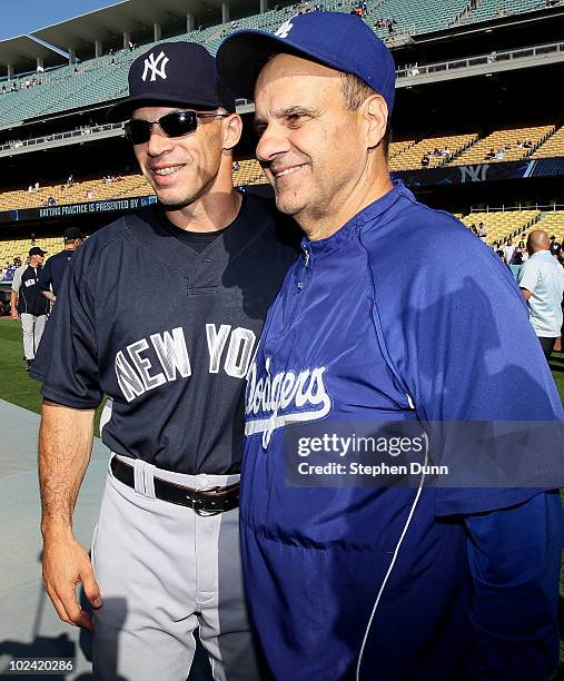 Manager Joe Girardi of the New York Yankees greets manager Joe Torre of the Los Angeles Dodgers before their game on June 25, 2010 at Dodger Stadium...