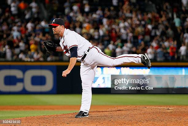 Closer Billy Wagner of the Atlanta Braves watches his pitch as he strikes out the final batter of the Detroit Tigers in the ninth inning to give him...