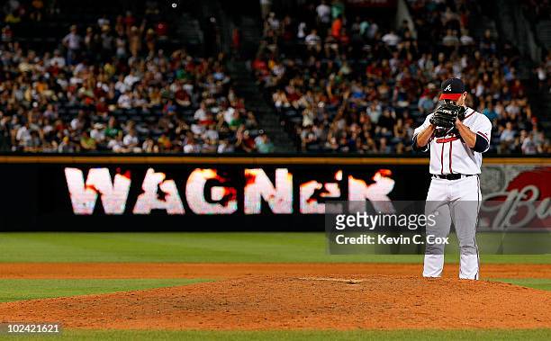 Closer Billy Wagner of the Atlanta Braves stands at the back of the mound before pitching in the ninth inning against the Detroit Tigers at Turner...