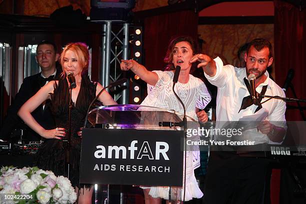 Kylie Minogue, Mademoiselle Agnes and guest participate to the auction of the Amfar inspiration night at Maxim's on June 25, 2010 in Paris, France.