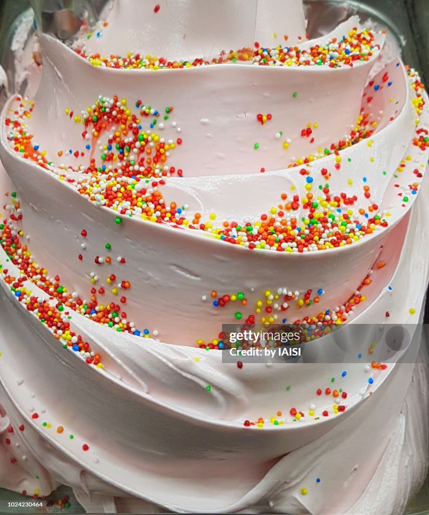 Close-up of bubble gum flavored ice cream with dessert topping