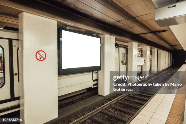 blank billboard at subway station - subway poster stock pictures, royalty-free photos & images