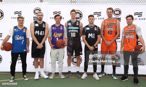 Players Tom Papley and Oliver Florent of the Sydney Swans and Josh Kelly and Toby Greene of the GWS Giants pose with Chris Goulding of Melbourne...