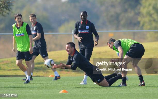 Gareth Barry, John Terry, Ledley King and Jamie Carragher play a handball game during the England training session at the Royal Bafokeng Sports...