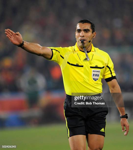 Referee Marco Rodriquez of Mexico signals during the 2010 FIFA World Cup South Africa Group H match between Chile and Spain at Loftus Versfeld...