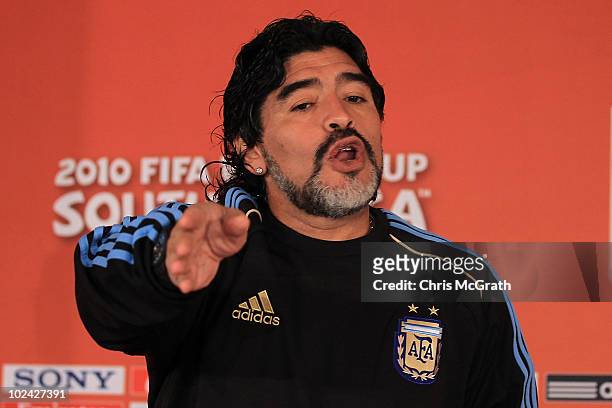 Argentina's head coach Diego Maradona gestures for photographers to leave a press conference at Loftus Versefeld Stadium on June 26, 2010 in...