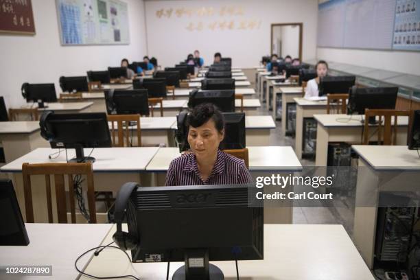 North Korea woman sits at a computer in an I.T training room at Kim Jong Suk Silk Factory on August 21, 2018 in Pyongyang, North Korea. Despite...