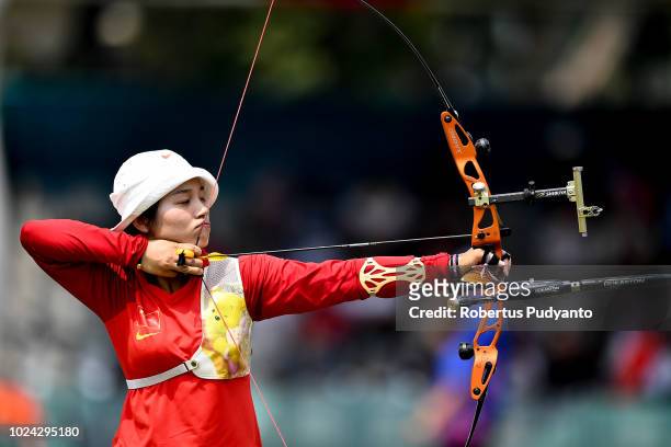 Xinyan Zhang of China shoots during Recurve Mixed Team Archery Final Rounds on day nine of the Asian Games on August 27, 2018 in Jakarta, Indonesia.