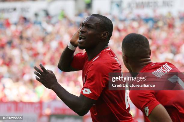 August 2018, Mainz, Germany: Soccer, Bundesliga, FSV Mainz 05 vs. VfB Stuttgart, 1st match-day in the Opel Arena. Anthony Ujah from Mainz cheers...