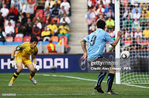 Luis Suarez of Uruguay scores the opening goal during the 2010 FIFA World Cup South Africa Round of Sixteen match between Uruguay and South Korea at...