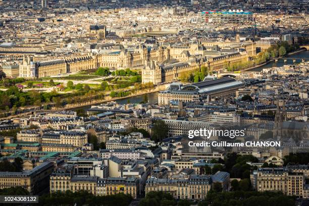 view over the louvre, orsay museum, the seine, and centre pompidou museum at sunset in paris, france. - louvre pyramid stock pictures, royalty-free photos & images