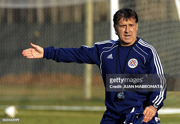 Paraguay's coach Gerardo Martino gestures during a training session at Michaelhouse school in Balgowan on June 26, 2010. Paraguay will face Japan in...