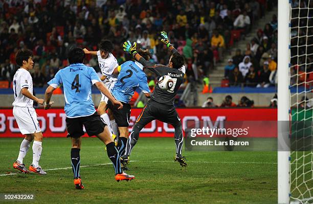 Lee Chung-Yong of South Korea scores his team's first goal past Fernando Muslera of Uruguay during the 2010 FIFA World Cup South Africa Round of...