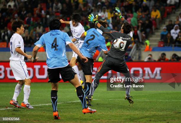 Lee Chung-Yong of South Korea scores his team's first goal past Fernando Muslera of Uruguay during the 2010 FIFA World Cup South Africa Round of...