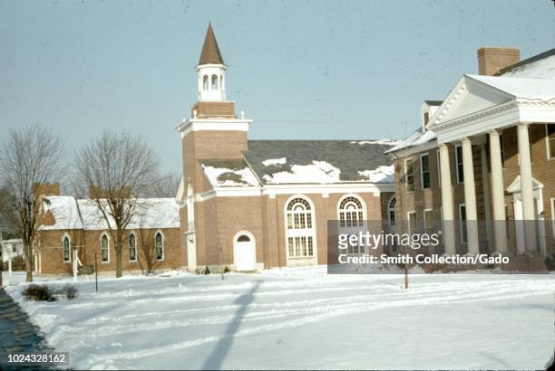 Chapel and other buildings on a snowy day at Asbury University, a Christian liberal arts university in Wilmore, Kentucky, 1955.