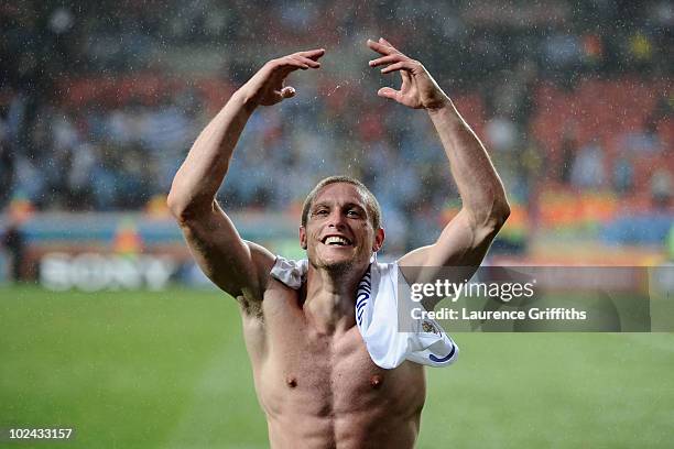 Diego Perez of Uruguay celebrates victory following the 2010 FIFA World Cup South Africa Round of Sixteen match between Uruguay and South Korea at...