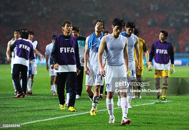 Park Ji-Sung captain of South Korea leads his dejected team off the field after being knocked out of the competition during the 2010 FIFA World Cup...