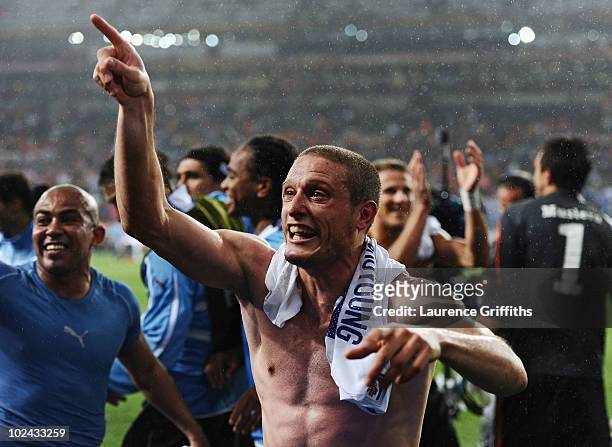 Diego Perez of Uruguay celebrates victory following the 2010 FIFA World Cup South Africa Round of Sixteen match between Uruguay and South Korea at...