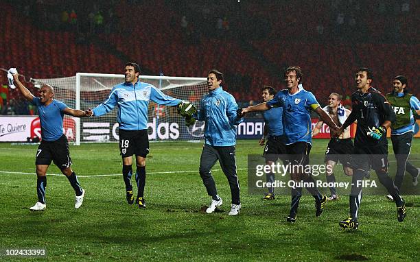 Egidio Arevalo Andres Scotti , Diego Lugano and Fernando Muslera of Uruguay celebrate after the 2010 FIFA World Cup South Africa Round of Sixteen...