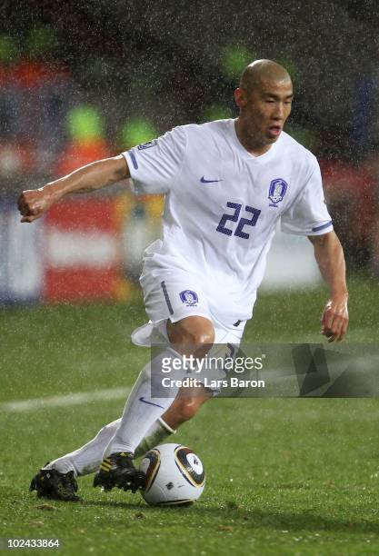 Cha Du-Ri of South Korea runs with the ball during the 2010 FIFA World Cup South Africa Round of Sixteen match between Uruguay and South Korea at...