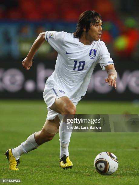 Park Chu-Young of South Korea runs with the ball during the 2010 FIFA World Cup South Africa Round of Sixteen match between Uruguay and South Korea...