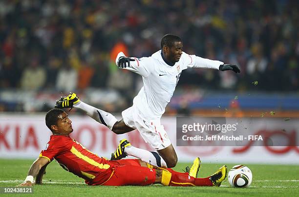 Kevin Prince Boateng of Ghana tackles Maurice Edu of the United States during the 2010 FIFA World Cup South Africa Round of Sixteen match between USA...