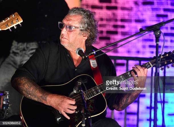 Rock and Roll Hall of Fame musician Steve Jones, founding member of Sex Pistols, performs onstage during the Johnny Ramone Tribute and Screening of...