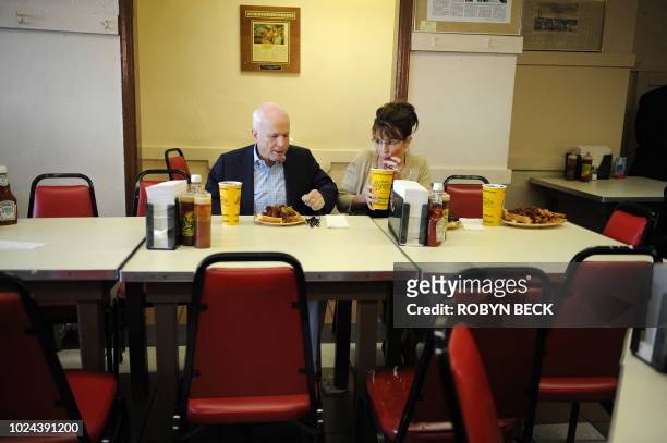 Republican presidential candidate John McCain and his running mate Alaska Governor Sarah Palin have a meal at Arthur Bryant's Barbeque restaurant in...