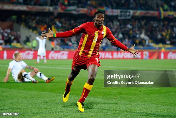 Asamoah Gyan of Ghana celebrates scoring his team's second goal in extra time during the 2010 FIFA World Cup South Africa Round of Sixteen match...