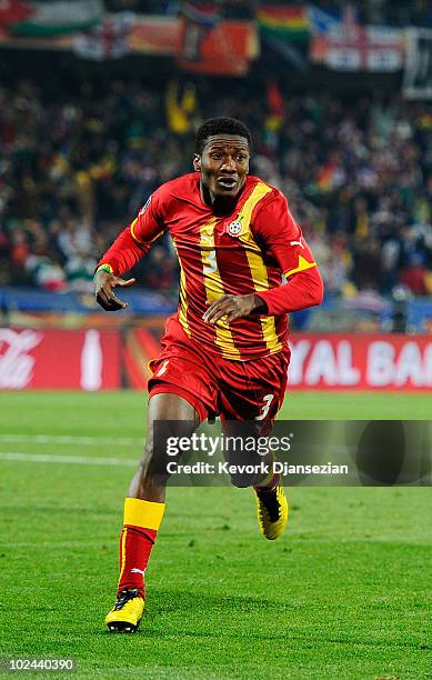 Asamoah Gyan of Ghana celebrates scoring his team's second goal in extra time during the 2010 FIFA World Cup South Africa Round of Sixteen match...