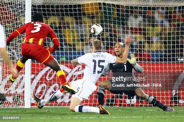 Asamoah Gyan of Ghana scores his side's second goal past Tim Howard of the United States during the 2010 FIFA World Cup South Africa Round of Sixteen...
