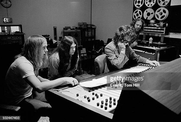 Lynyrd Skynyrd members Ronnie Van Zant and Gary Rossington work with producer Al Kooper on "Pronounced Lynyrd Skynyrd" with engineer Bob “Tub”...