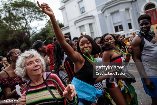 Revellers dance on the final day of the Notting Hill Carnival on August 27, 2018 in London, England. The Notting Hill Carnival, which has taken place...