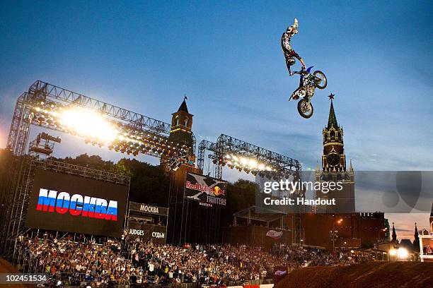 In this handout image from Global-Newsroom, Jim McNeil from US performs in front of the St. Basils basilica in Moscows Red Square during the third...