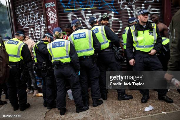 Police officers stop and search people on the final day of the Notting Hill Carnival on August 27, 2018 in London, England. The Notting Hill...