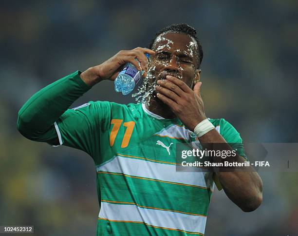 Didier Drogba of Ivory Coast pours water over his head during the 2010 FIFA World Cup South Africa Group G match between North Korea and Ivory Coast...