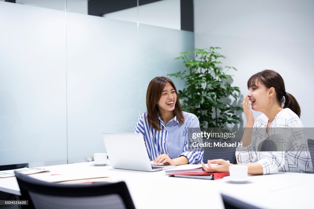 Business women looking at computer in office