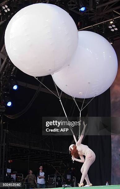 British singer Paloma Faith wears two giant helium-filled balloons while performing on the Pyramid stage on the final day of the Glastonbury festival...