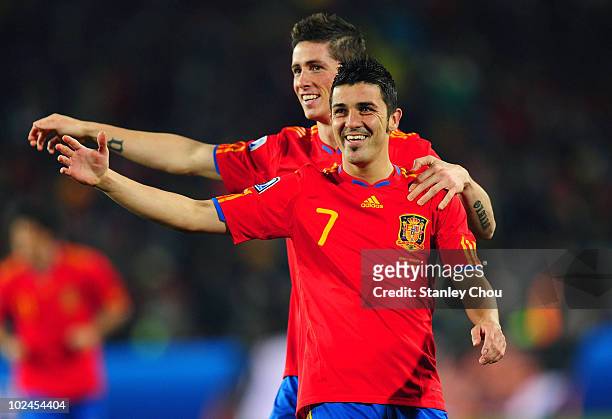 David Villa of Spain celebrates with team mate Fernando Torres during the 2010 FIFA World Cup South Africa Group H match between Spain and Honduras...