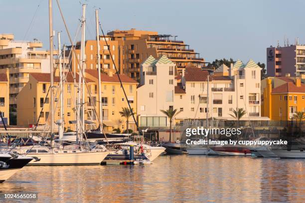 sun setting on vilamoura - vilamoura stock pictures, royalty-free photos & images