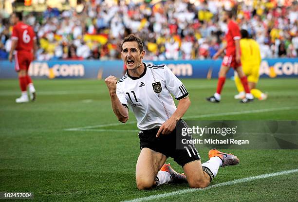 Miroslav Klose of Germany celebrates scoring the opening goal during the 2010 FIFA World Cup South Africa Round of Sixteen match between Germany and...