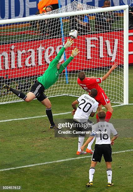 Matthew Upson of England heads the ball past Manuel Neuer of Germany and scores his side's first goal during the 2010 FIFA World Cup South Africa...