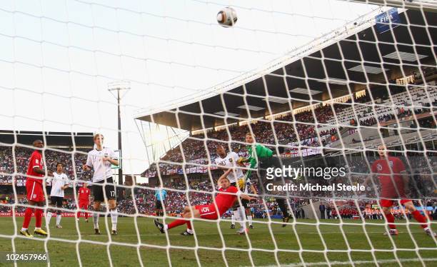 Matthew Upson of England scores the first goal for his team past Manuel Neuer of Germany during the 2010 FIFA World Cup South Africa Round of Sixteen...