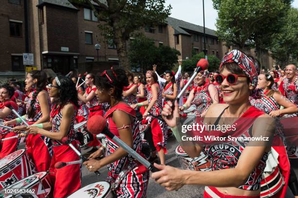 The grand finale of the Notting Hill Carnival, during which performers present their costumes and dance to the rhythms of the mobile sound systems or...